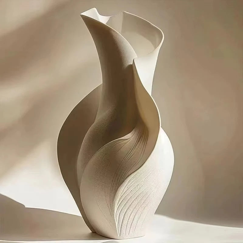 Beige ceramic vase with wavy design on a beige background